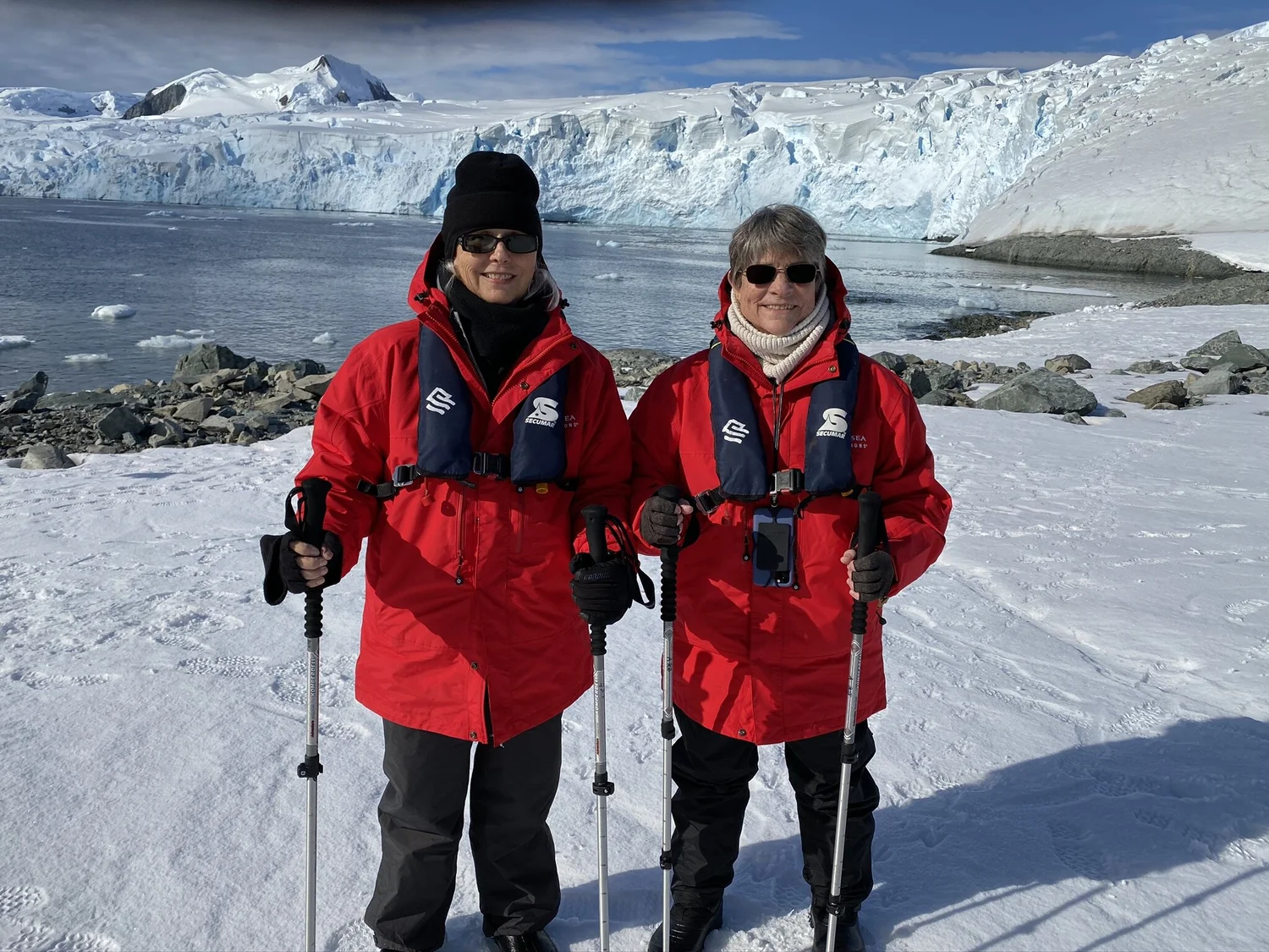 Deborah Lee Prescott and her friend standing in a snowy landscape in Antarctica.